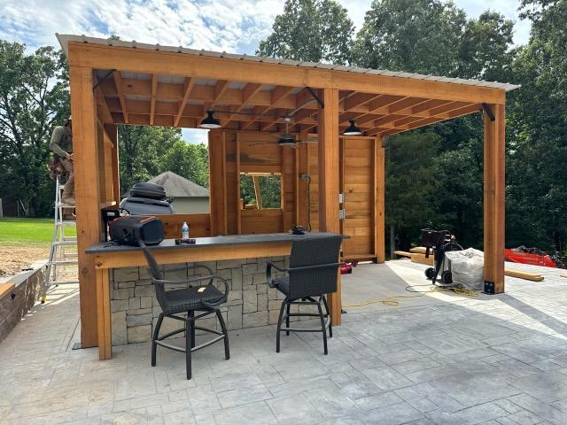 Timber frame pavilion with an outdoor bar built with OSL timbers
