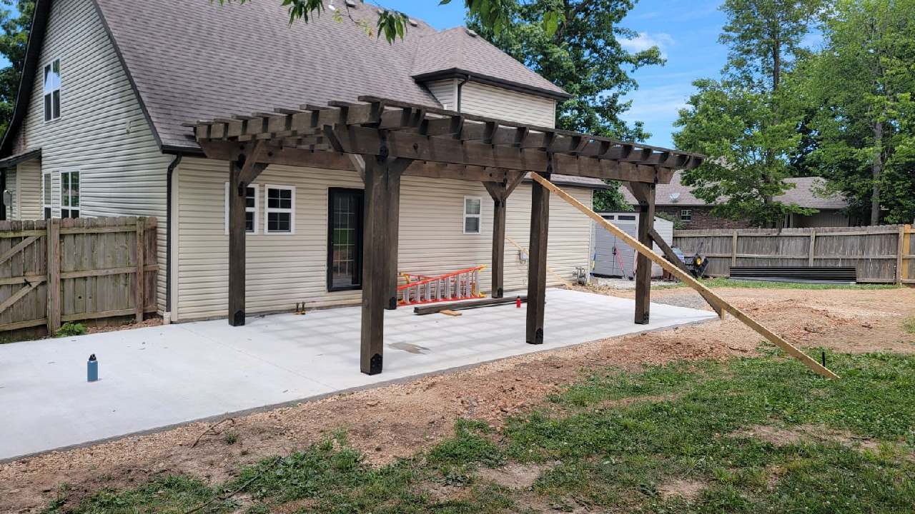 Attached timber pergola shading a backyard patio